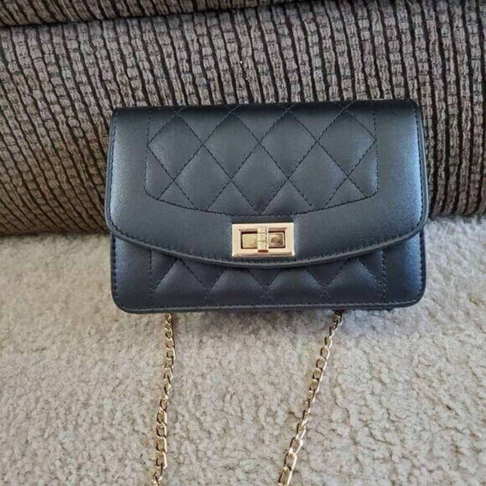 Black crossbody bag with gold tone chain